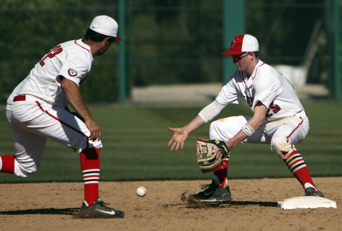 Second baseman Ezra Steinberg, right, of Harvard-Westlake, a member of The Times' high school All-Area baseball team, makes a play at second base with shortstop Brian Ginsberg.