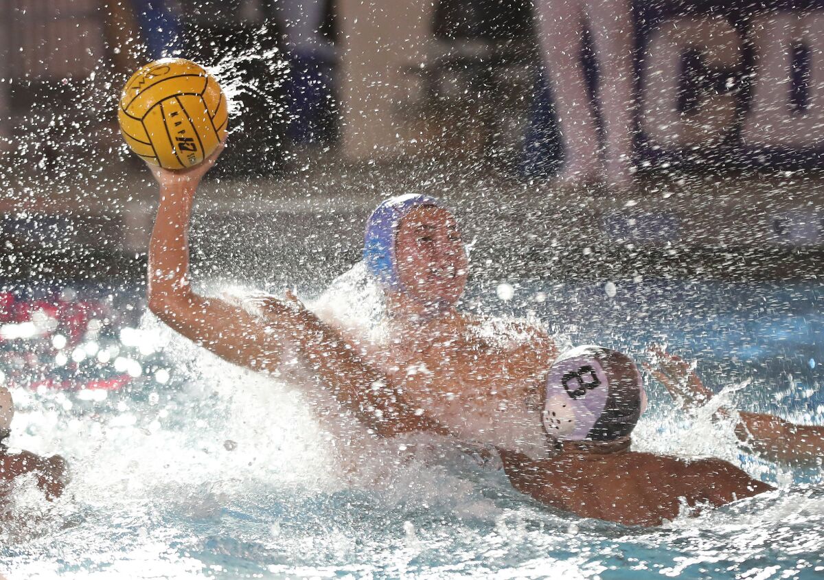 Corona del Mar's Jackson Harlan (8) pulls up quickly to shoot and score against El Dorado on Wednesday.