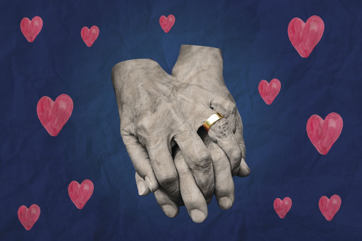 Holding hands surrounded by hearts