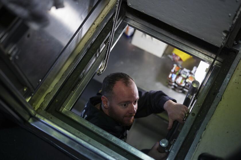 Sailors prepare a French Rubis-class nuclear powered submarine to participare in NATO's upcoming Neptune Strike training exercise at the Toulon naval base in southern France, Monday, April 15, 2024. (AP Photo/Daniel Cole)