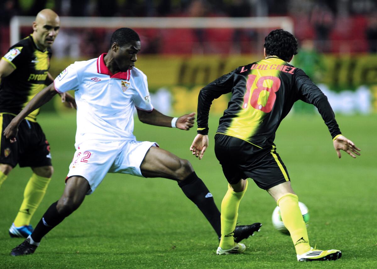 Sevilla defender Geoffrey Kondogbia clears the ball against Zaragoza's Lucas Wilchez during the Copa del Rey quarterfinals on Jan. 23, 2013.