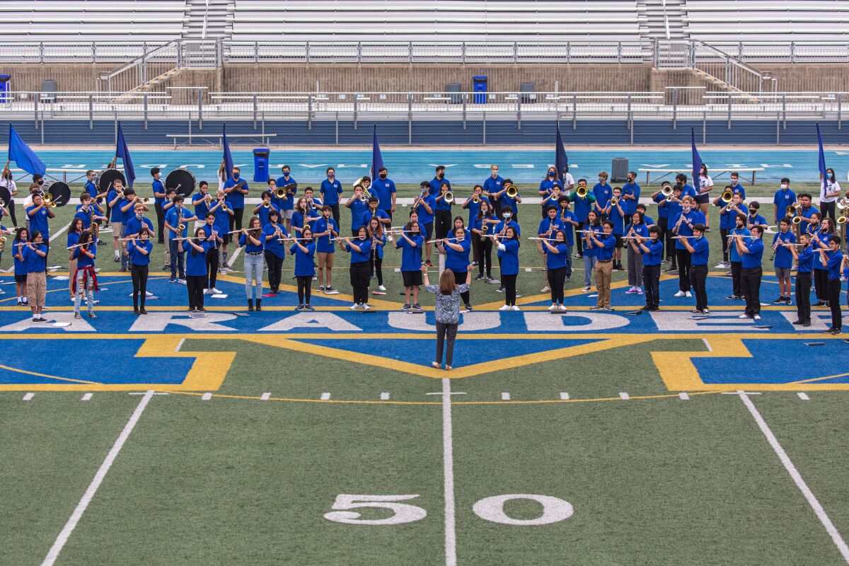 The Mira Mesa High School marching band performs before class on the first day of school on Aug. 30, 2021.