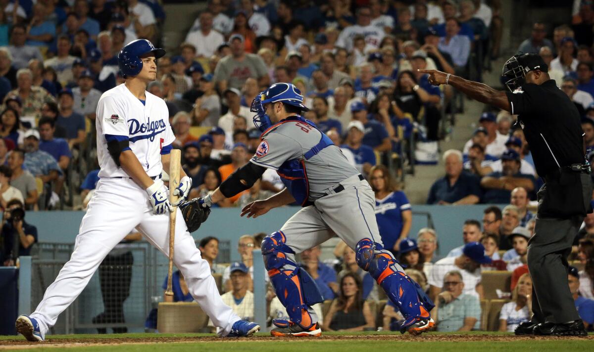 Dodgers infielder Corey Seager is tagged by Mets catcher Travis D'Arnaud after striking out during the fifth inning of Game 1 of the National League division series.