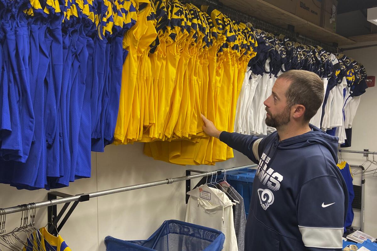 Brendan Burger checks out the Rams' color rush jerseys for their Monday night game against Baltimore.