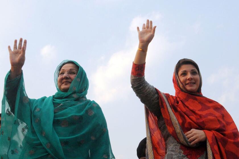 Maryam Safdar, right, and her mother, Kulsoom Nawaz, wave to supporters during an election rally in Lahore in 2013. Safdar, daughter of Pakistani Prime Minister Nawaz Sharif, was named in leaked papers as a trustee or owner of companies based in the British Virgin Islands, a popular tax haven.