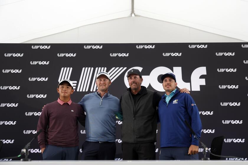Phil Mickelson, 2nd right, and his Hy Flyers team, Justin Harding, 2nd left, Ratchanon Chantananuwat, left, and Chase Koepka attend a press conference at the Centurion Club, Hertfordshire, England, ahead of the LIV Golf Invitational Series, Wednesday June 8, 2022. (Steven Paston/PA via AP)