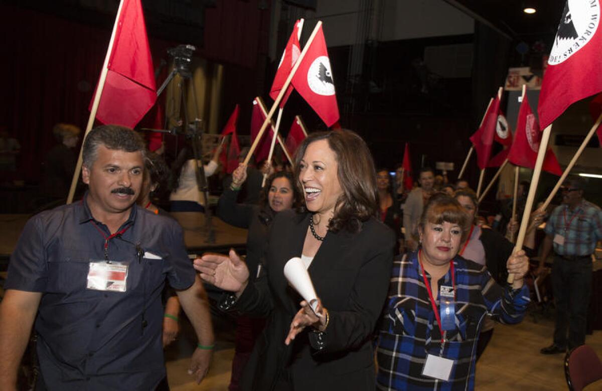California Atty. Gen. Kamala Harris, a candidate for U.S. Senate, enters the United Farm Workers convention in Bakersfield in May chanting "Sí, se puede!"