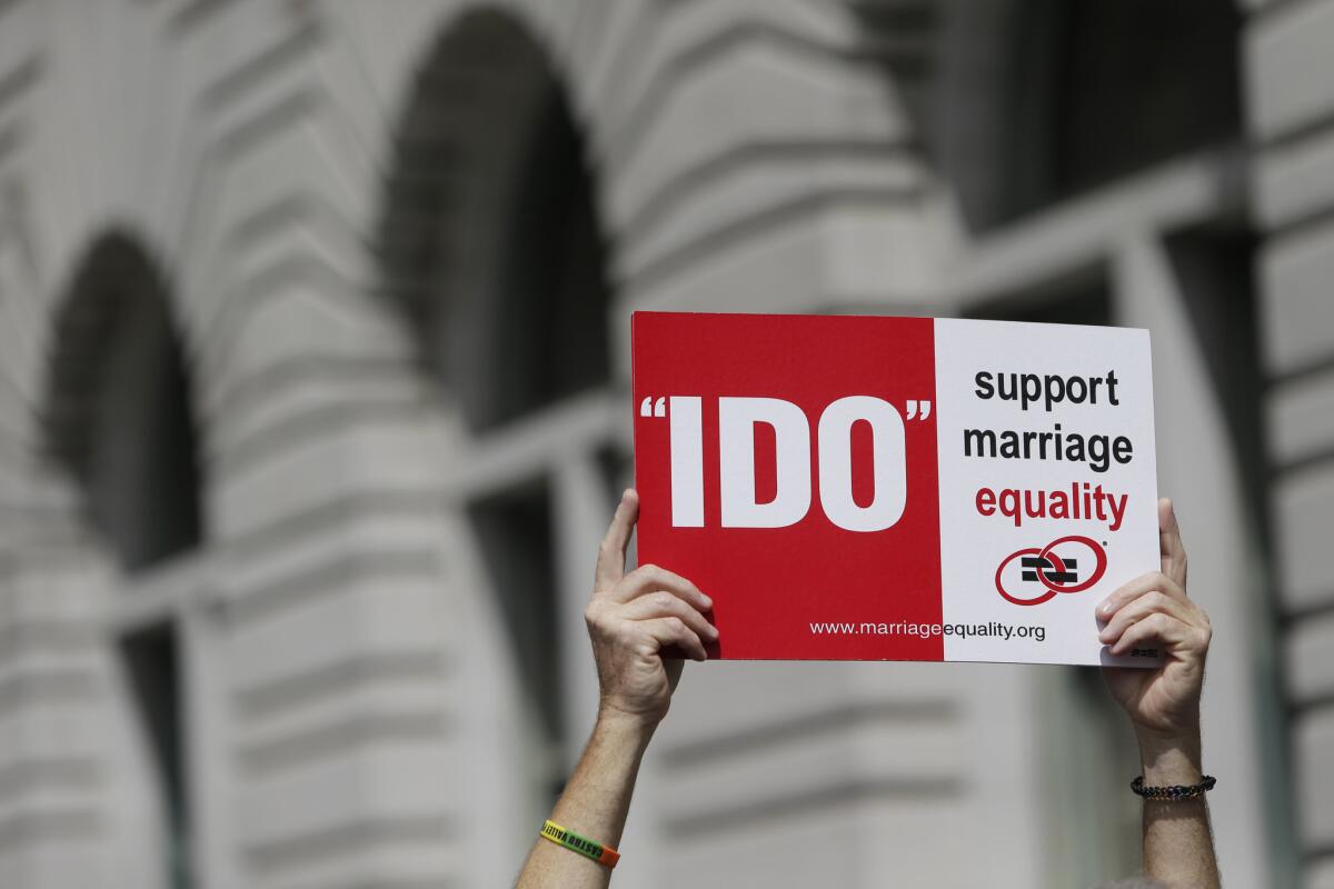 A supporter of gay marriage holds a sign outside the U.S. 9th District Court of Appeals in San Francisco.