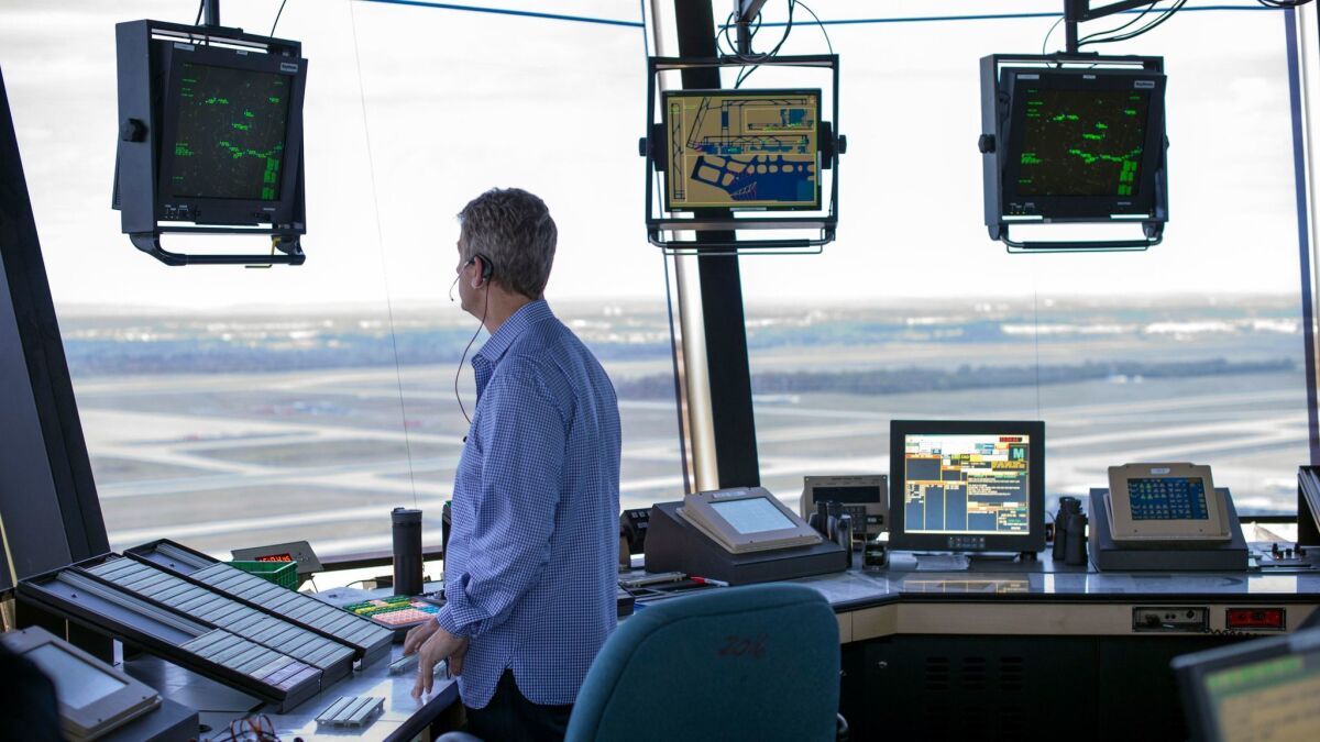 An air traffic controller works at Washington Dulles International Airport in 2016.