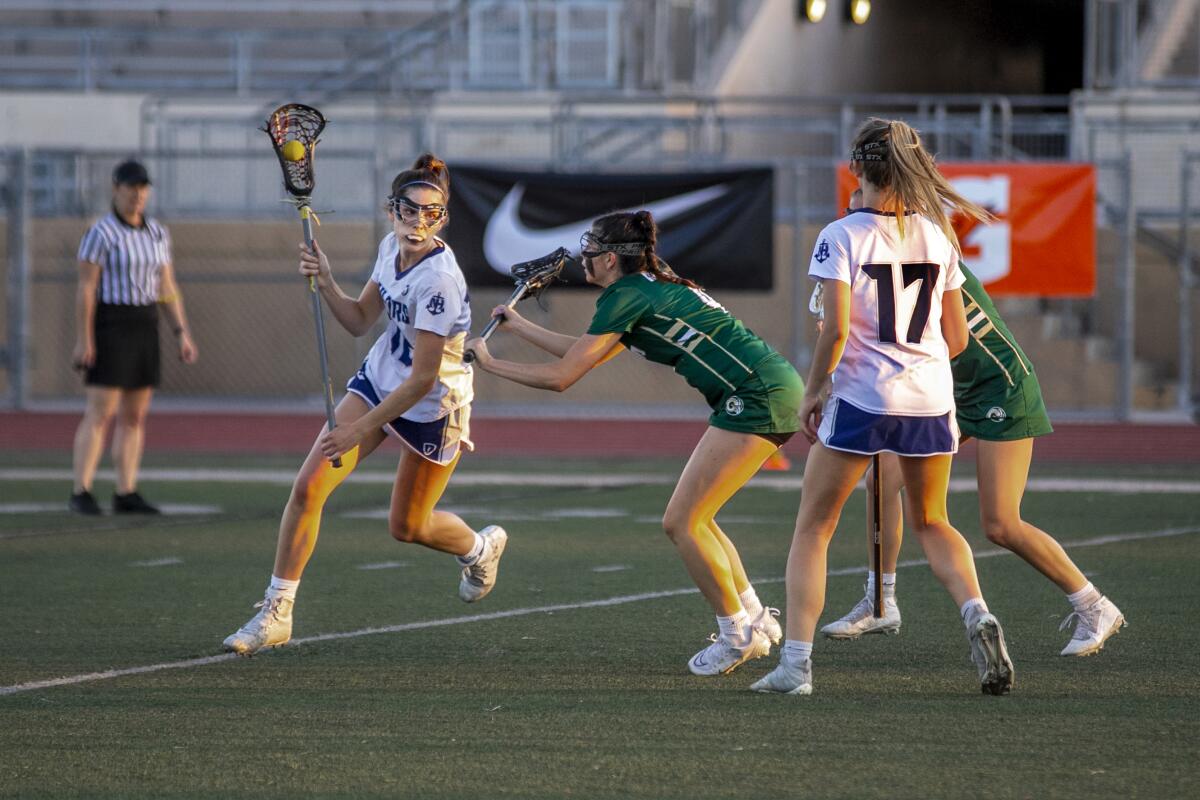 Murrieta Mesa's Jayda Johnson tries to block Newport Harbor's Olivia Gritzmacher.