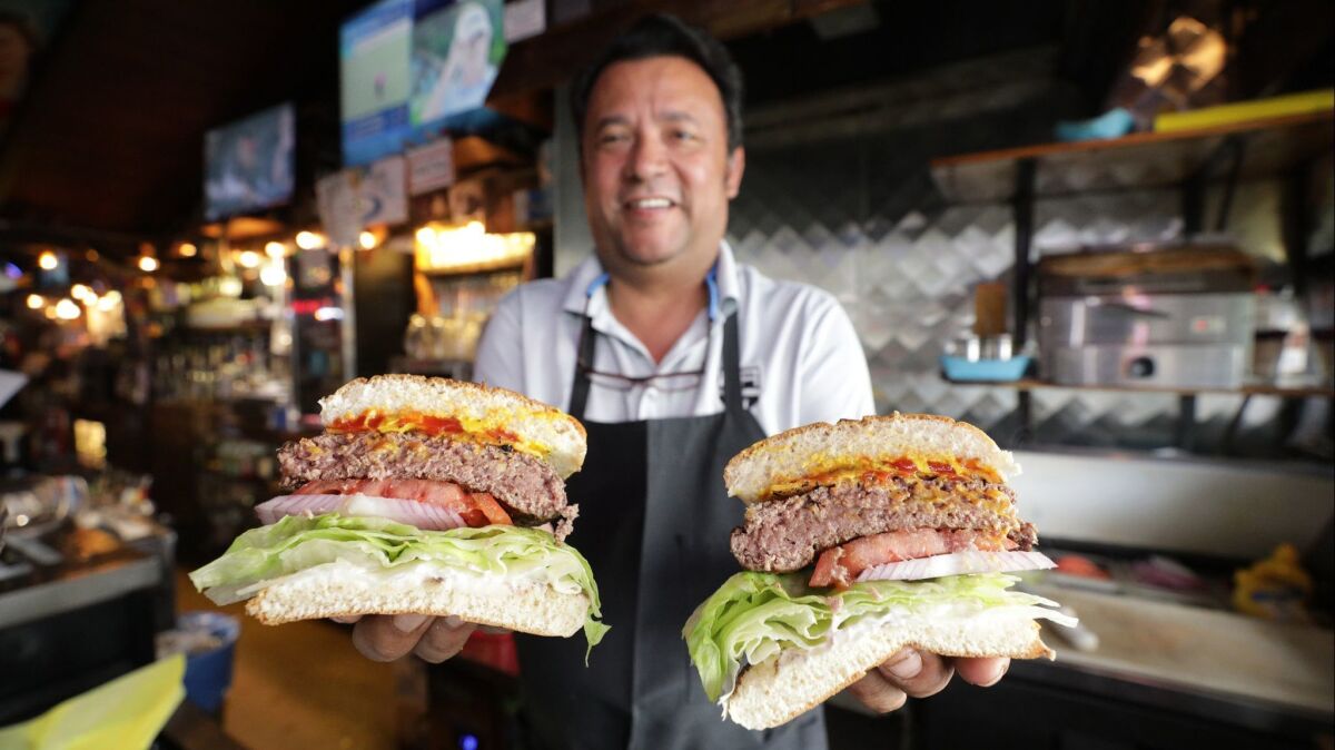 Our No. 1 noir bar pick, Ercoles 1101, has been around for 90 years. Here, Martin Anguiano serves up the famed burgers.