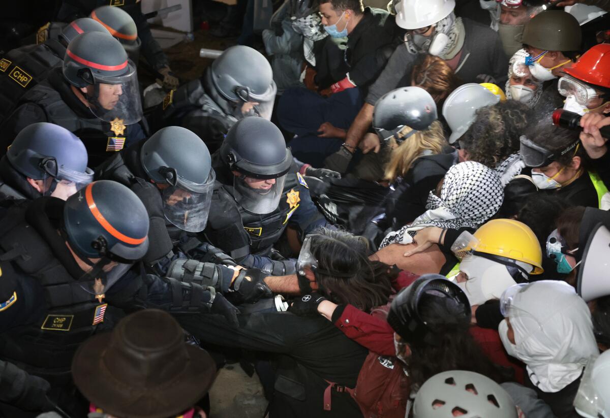 Police clash with pro-Palestinian protesters after an order to disperse was given at UCLA.