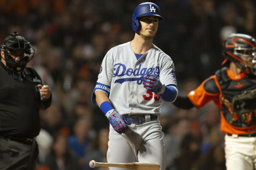 Los Angeles Dodgers' Cody Bellinger (35) reacts after being called out on strikes to end the top of the sixth inning of the team's baseball game against the San Francisco Giants, Friday, June 7, 2019, in San Francisco. (AP Photo/D. Ross Cameron)