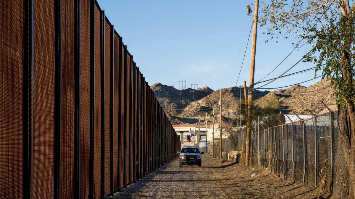 A Border Patrol officer makes his rounds near central El Paso in December. Acting Pentagon chief Patrick Shanahan has authorized $1 billion to build part of the wall sought by President Trump along the U.S.-Mexico border.