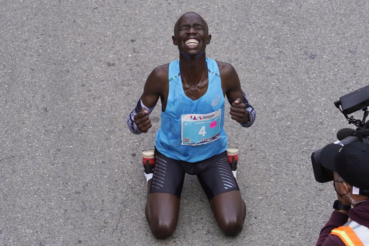 Los Marathon Elite runner John Korir reacts after winning the 36th Los Angeles Marathon, Sunday, Nov. 7, 2021. (AP Photo/Damian Dovarganes)