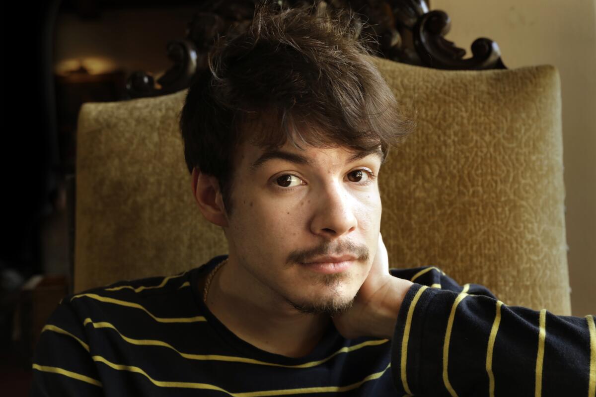 A man in a blue and yellow striped shirt