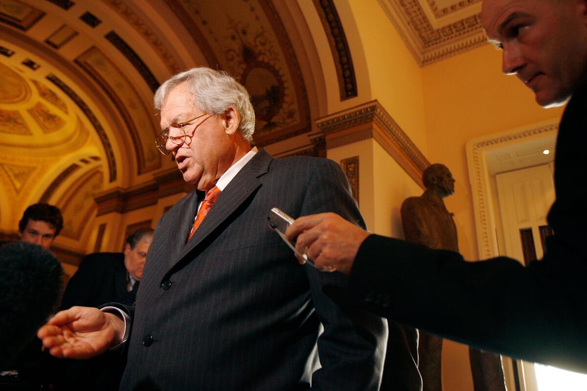Dennis Hastert is shown in this 2007 file photo, talking to reporters after announcing his resignation from Congress.