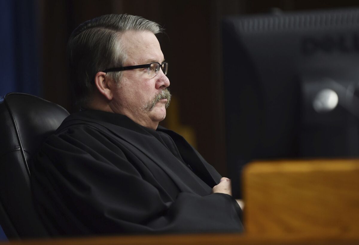 Jackson County Circuit Court Judge John McBain presides over a murder trial at the Jackson County Courthouse on Feb. 10, 2020, in Jackson, Mich. The maverick judge in Michigan known for ripping into criminal defendants is catching criticism again from a higher court. The Michigan Court of Appeals suggested McBain is ripe for a misconduct investigation for how he handled the sentencing of a woman convicted of killing her boyfriend on Valentine's Day 2015. (J. Scott Park | MLive.com/Jackson Citizen Patriot via AP)