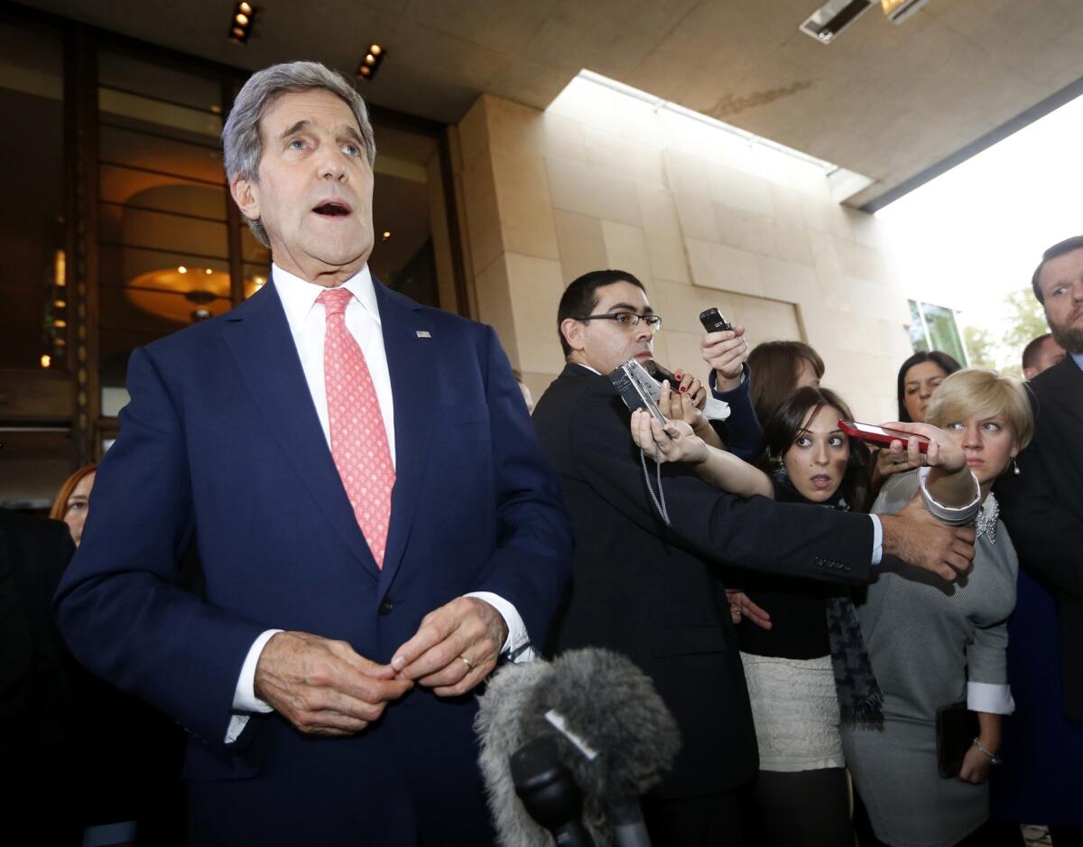 Secretary of State John Kerry speaks to the press upon his arrival in Geneva on the second day of talks with Iran about the country's nuclear program.