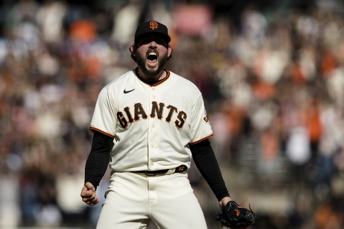 San Francisco reliever Dominic Leone reacts after the Giants' win over the San Diego Padres on Sunday.