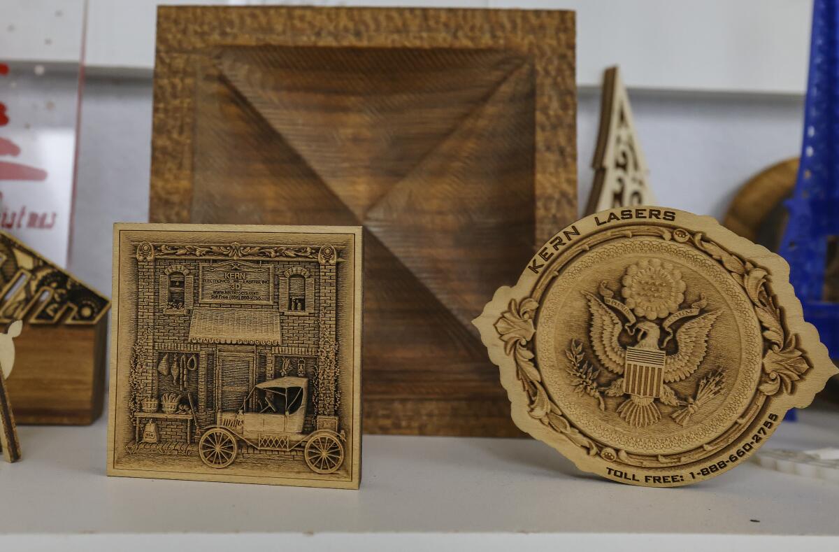Laser etched wood pieces made by members at the San Diego Fine Woodworkers Association workshop.