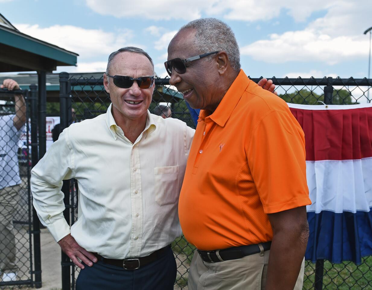 Hall of Famer and former Orioles star Frank Robinson, right, shares a laugh with MLB commissioner Rob Manfred before the Play Ball event at Carroll Park on Aug. 26, 2015.