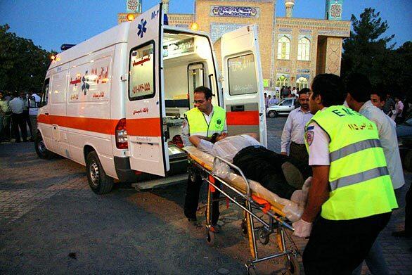 Emergency workers transport an injured passenger to a hospital in Mashhad, an important pilgrimage city for Shiite Muslims.