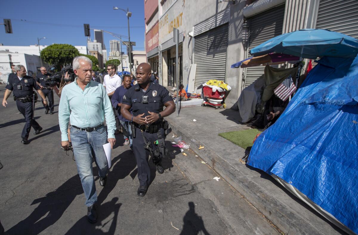 Republican candidate for governor John Cox on tours skid row in downtown Los Angeles.