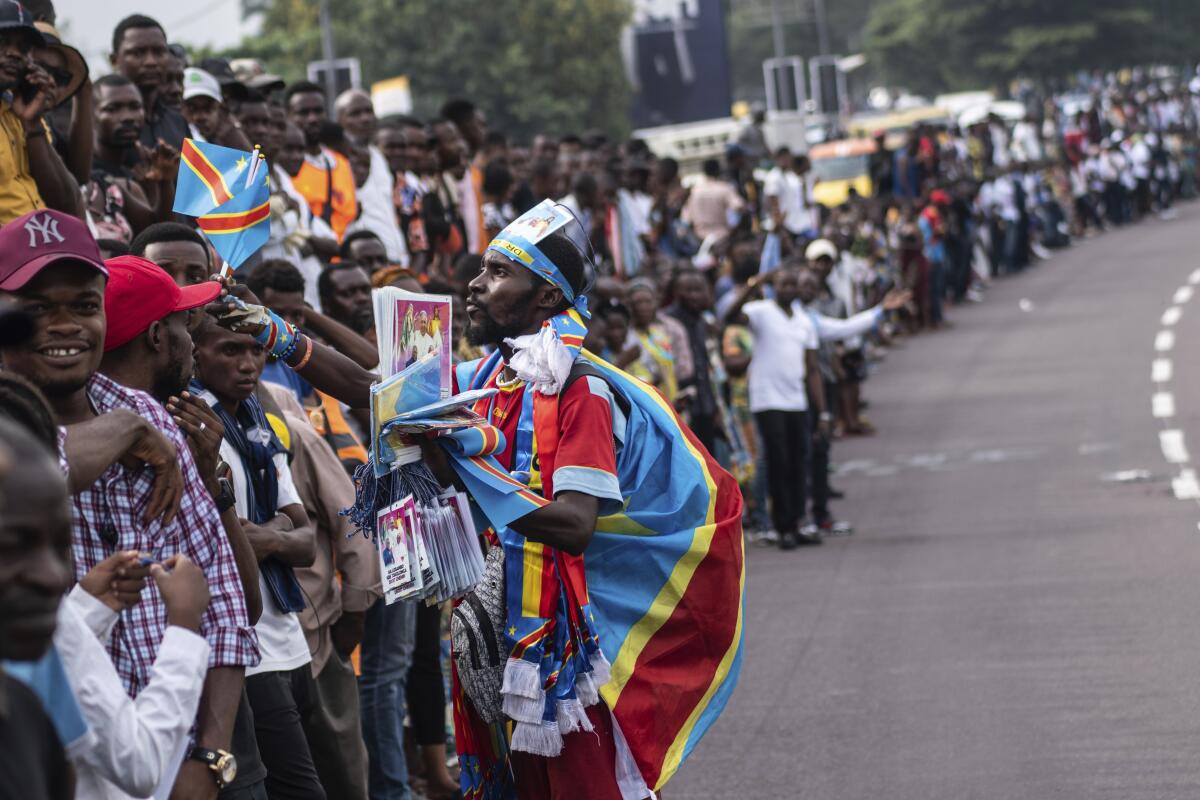Well-wishers wait for Pope Francis in Kinshasa, Congo.