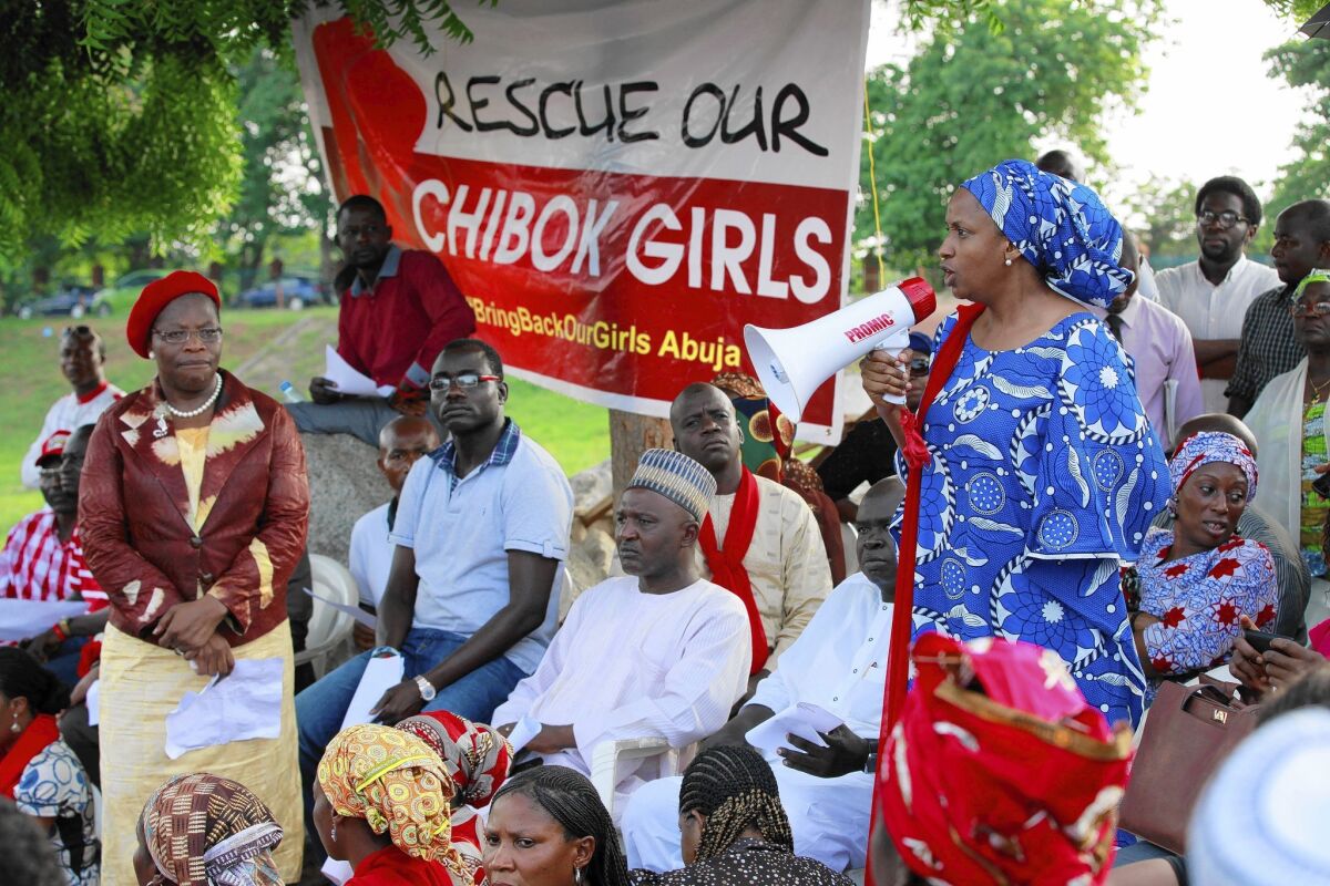 A woman makes a speech during a rally in Abuja calling on the Nigerian government to rescue the 276 schoolgirls held by the militant group Boko Haram.