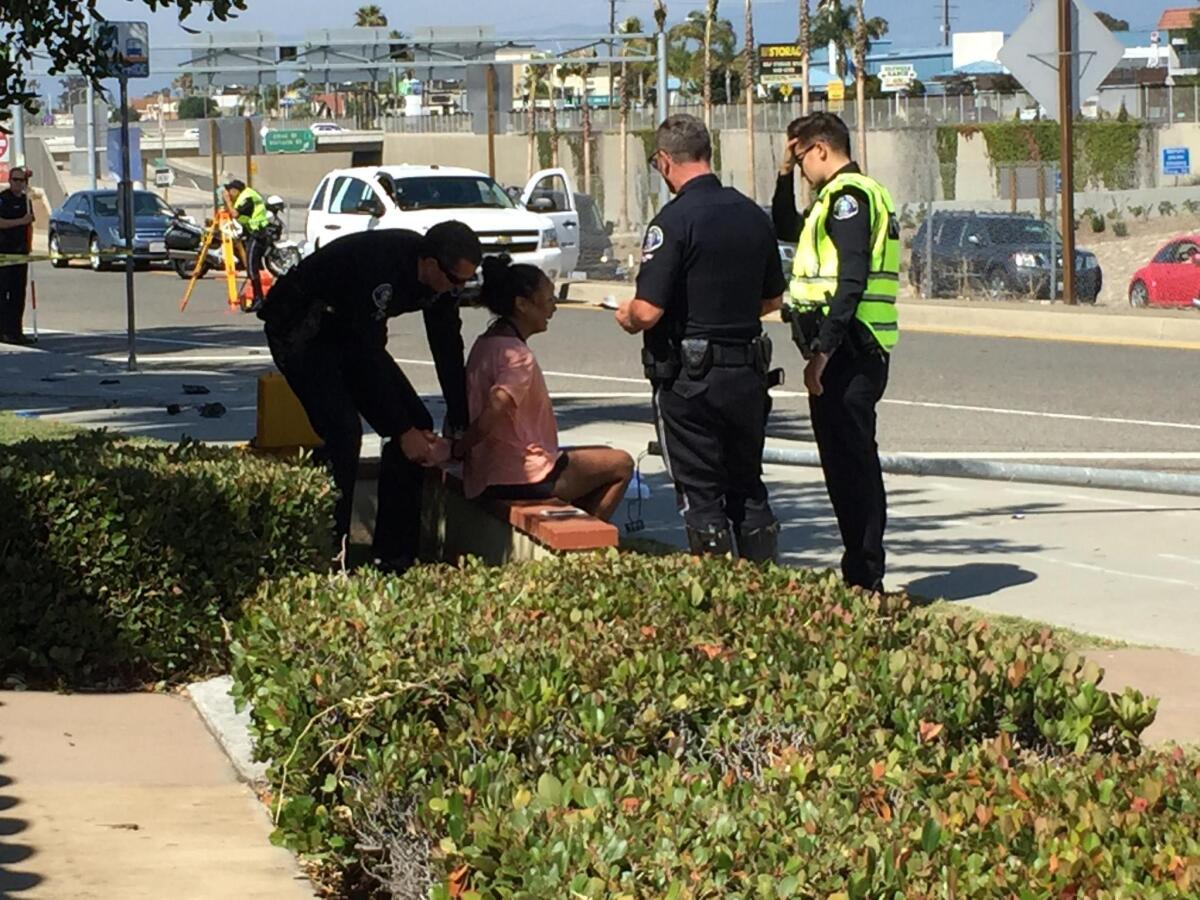 A woman is arrested Friday after a Mercedes-Benz SUV struck and killed a pedestrian on a crosswalk along Newport Boulevard in Costa Mesa. Police identified the woman as the SUV’s driver, Anna Marie McPherson of Irvine.
