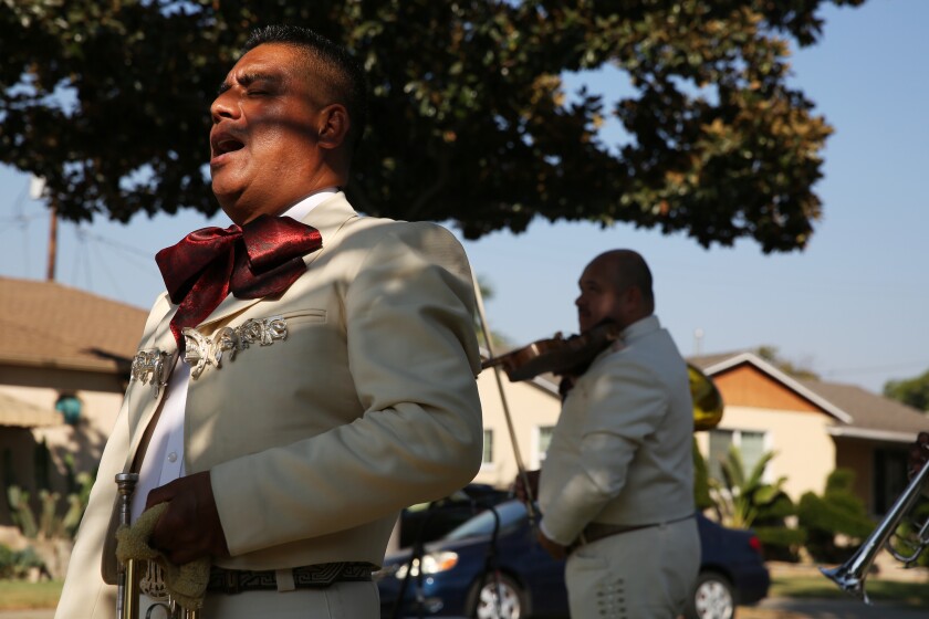 Column: How do you show up en masse to celebrate Grandma's
birthday without killing her with COVID-19? 2 A mariachi band plays during Angelita Arellano's 98th birthday in East Los Angeles.