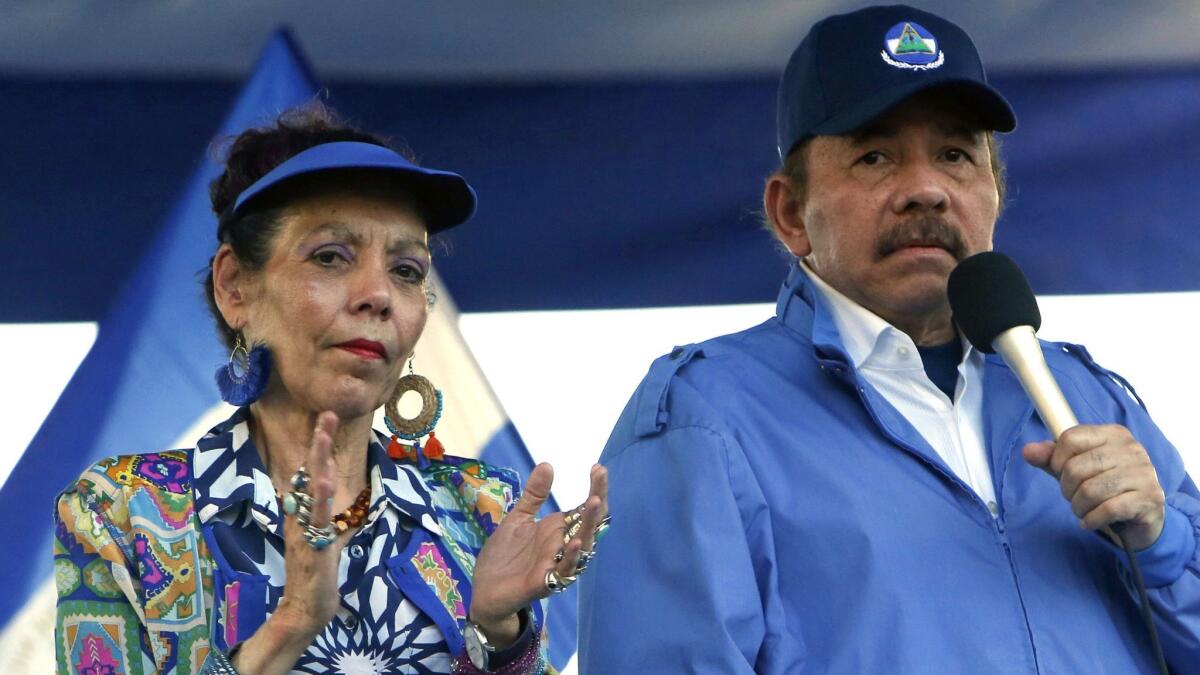 Nicaragua's President Daniel Ortega and his wife, Vice President Rosario Murillo, lead a rally in Managua in September 2018. Ortega forcefully quashed last year's protests, effectively outlawing opposition demonstrations.