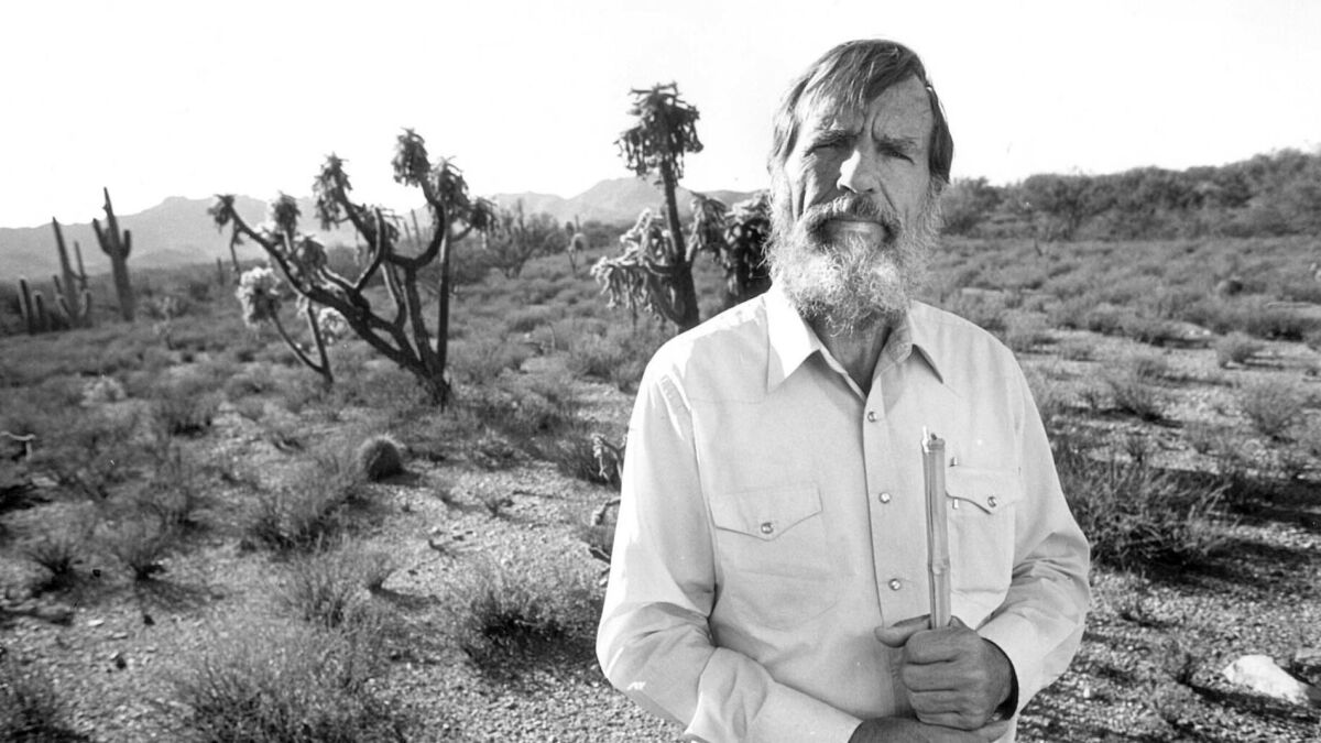 Edward Abbey, naturalist and novelist, at his Tucson home in 1987.