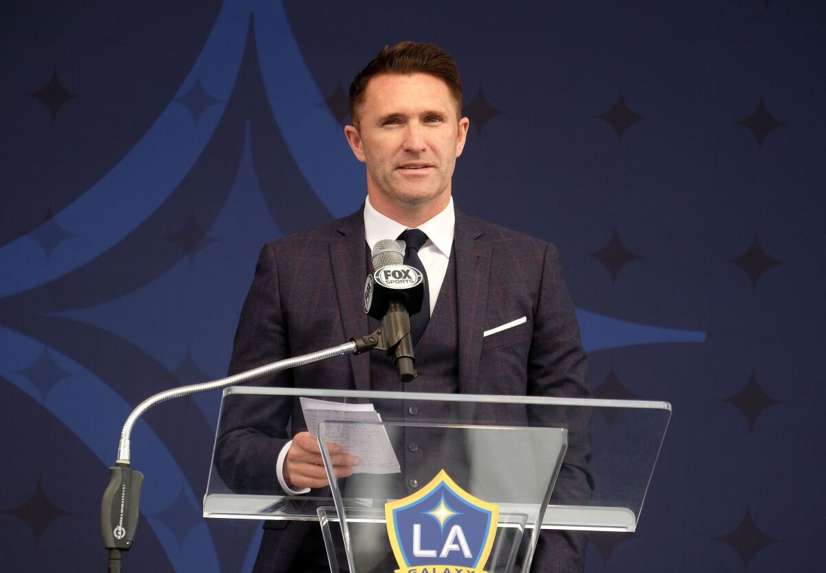 Robbie Keane speaks at the statue ceremony for David Beckham in 2019.