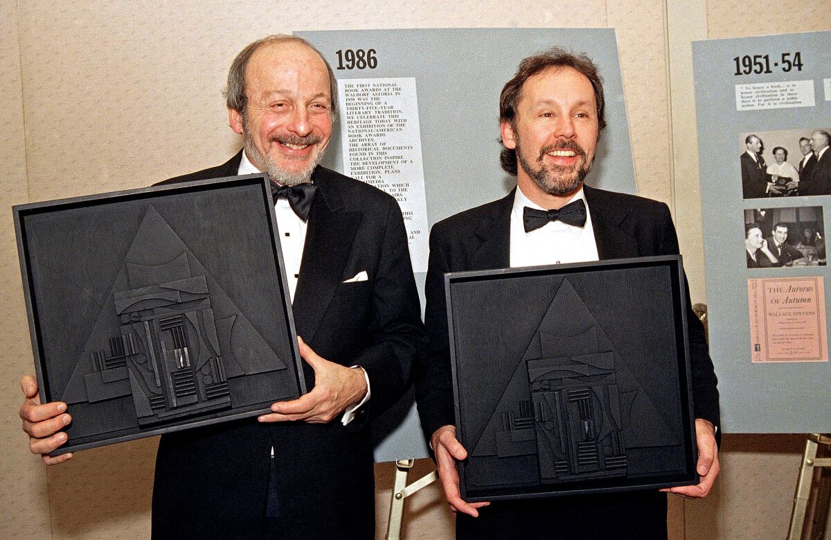 Authors E.L. Doctorow, left, and Barry Lopez pose with their American Book Awards on Nov. 17, 1986.
