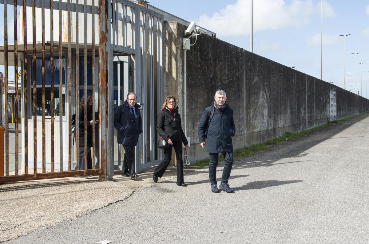 Italian senators exit a migrants repatriation center 