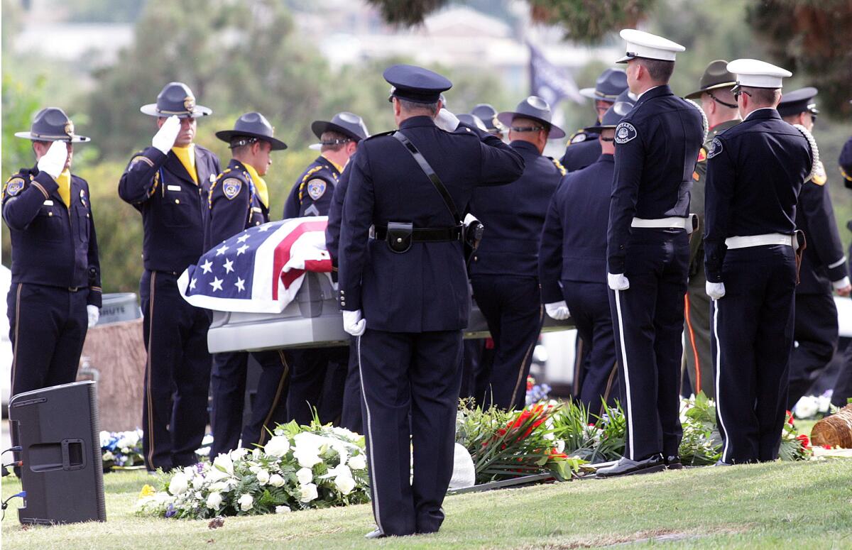 The casket is lead between hundreds of officers at attention at the funeral for Bakersfield police officer David Nelson at Forest Lawn Memorial Park in Glendale on Wednesday, July 1, 2015.