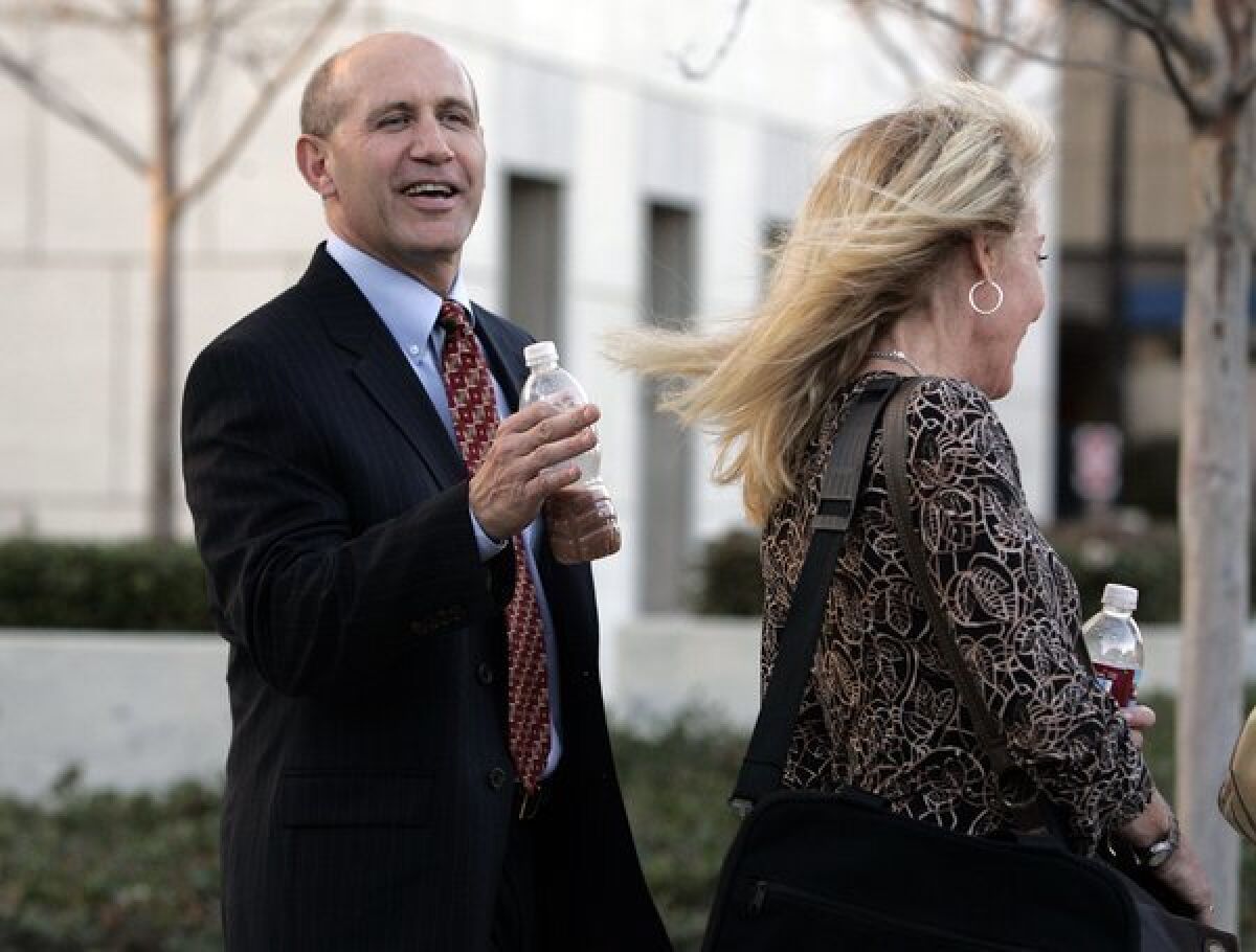 Former Orange County Sheriff Michael Carona and his wife, Deborah, arrive at the Ronald Reagan Federal Building and United States Courthouse in Santa Ana during his trial in 2009.