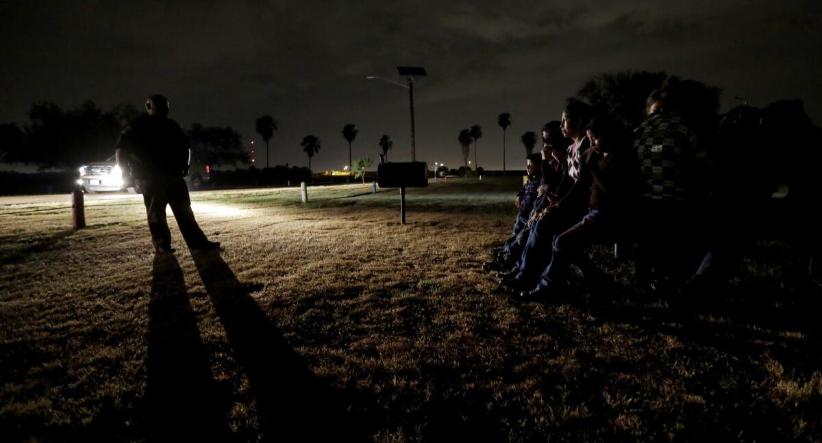 Central American immigrants are stopped in Granjeno, Texas, last month.