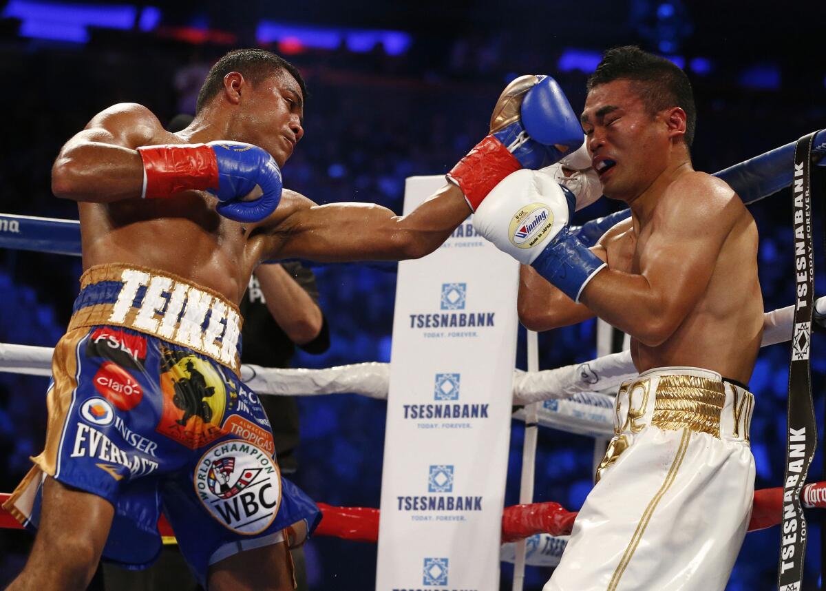 Roman Gonzalez lands a left punch to the face of Brian Viloria in the eighth round of their WBC flyweight title bout at Madison Square Garden in New York on Saturday.