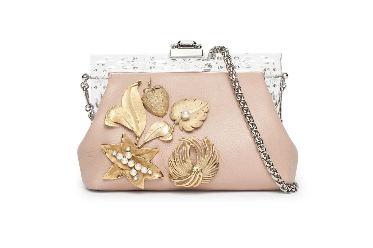 Dolce & Gabbana leather clutch with brooch trim, $3,995 at Dolce & Gabbana in Beverly Hills, (310) 888-8701, www.dolcegabbana.it