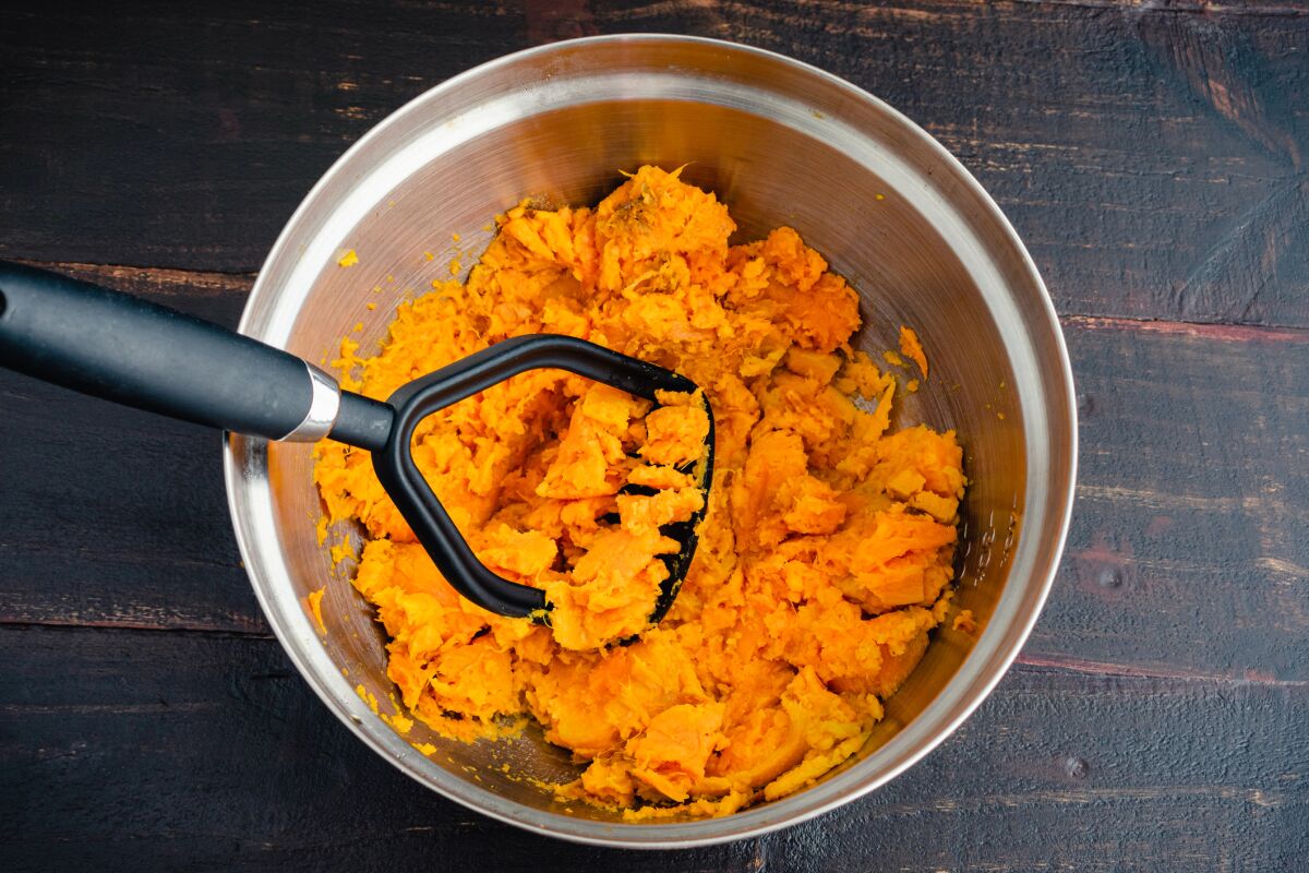 Butter, brown sugar, pecans, mandarin oranges and rum add layers of surprises to this relatively simple sweet potato recipe.