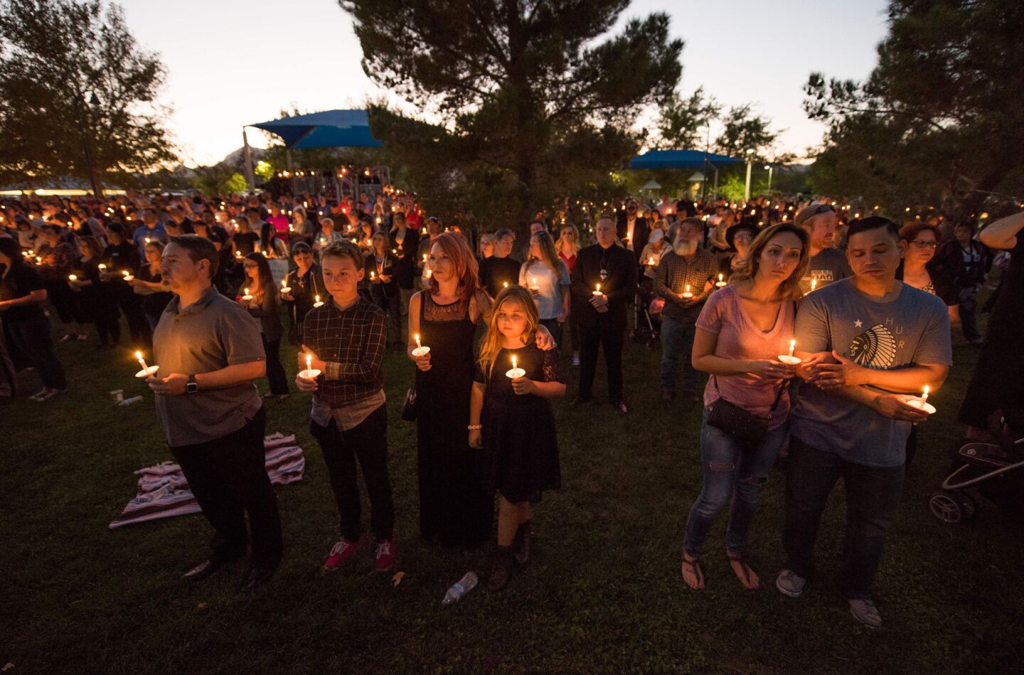 People attend a tribute to Las Vegas Police Officer Charleston Hartfield, who was killed in the mass shooting Sunday.