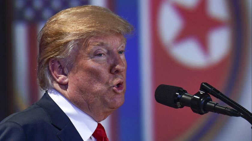 U.S. President Donald Trump answers questions about the summit with North Korea leader Kim Jong Un during a press conference on Sentosa Island in Singapore on June 12.