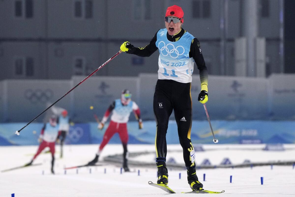  Vinzenz Geiger shouts while he skis at the 2022 Olympics.