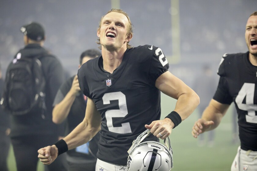Las Vegas Raiders kicker Daniel Carlson (2) celebrates while running off the field after kicking the game-winning field goal against the Los Angeles Chargers during overtime of an NFL football game, Sunday, Jan. 9, 2022, in Las Vegas. (AP Photo/Ellen Schmidt)