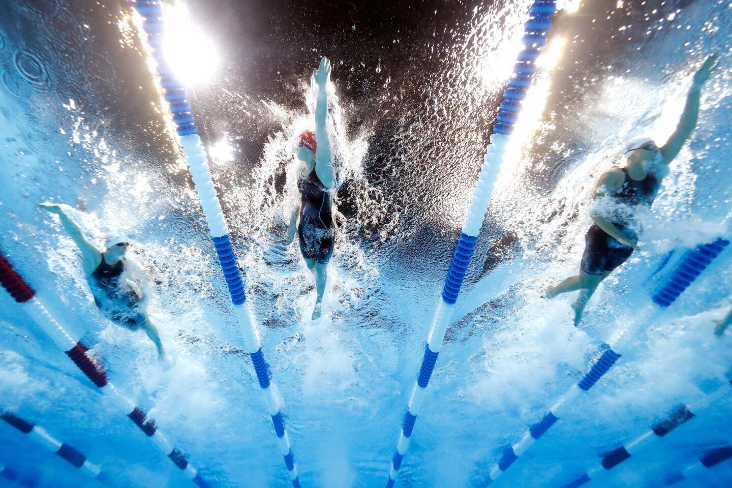Becca Mann, Katie Ledecky and Cierra Runge of the United States competes in a heat for the Women's 400 Meter Freestyle during Day Two.