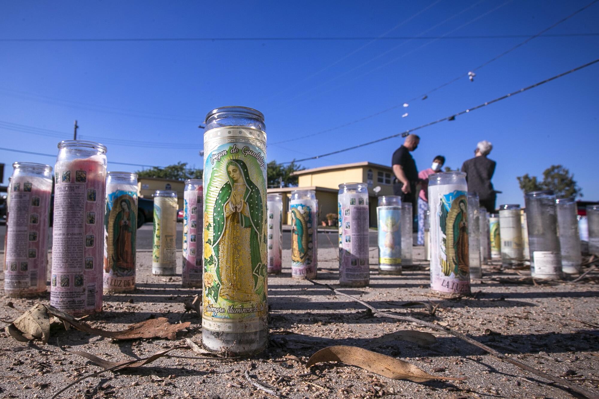 Memorial candles sit outside Nickerson Gardens.