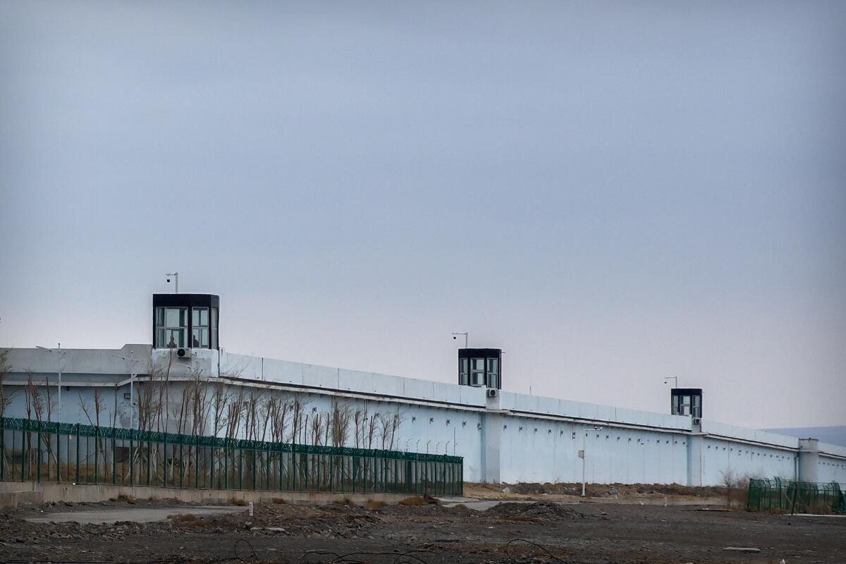 Guard towers line a perimeter wall  of the Urumqi No. 3 Detention Center in Dabancheng in western China